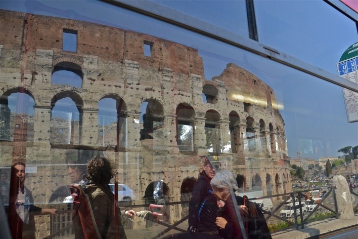 Contamination, cultural heritage reflected in urban bus window, part of the Coliseum<br />Foto Fabio José Martins de Lima 