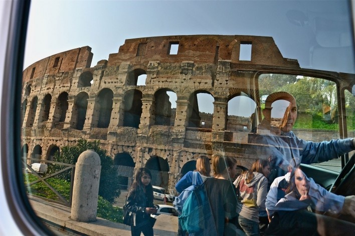 Contamination, cultural heritage reflected in urban bus window, part of the Coliseum<br />Foto Fabio José Martins de Lima 