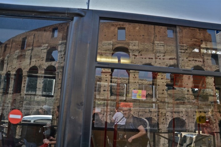 Contamination, cultural heritage reflected in urban bus window, part of the Coliseum<br />Foto Fabio José Martins de Lima 